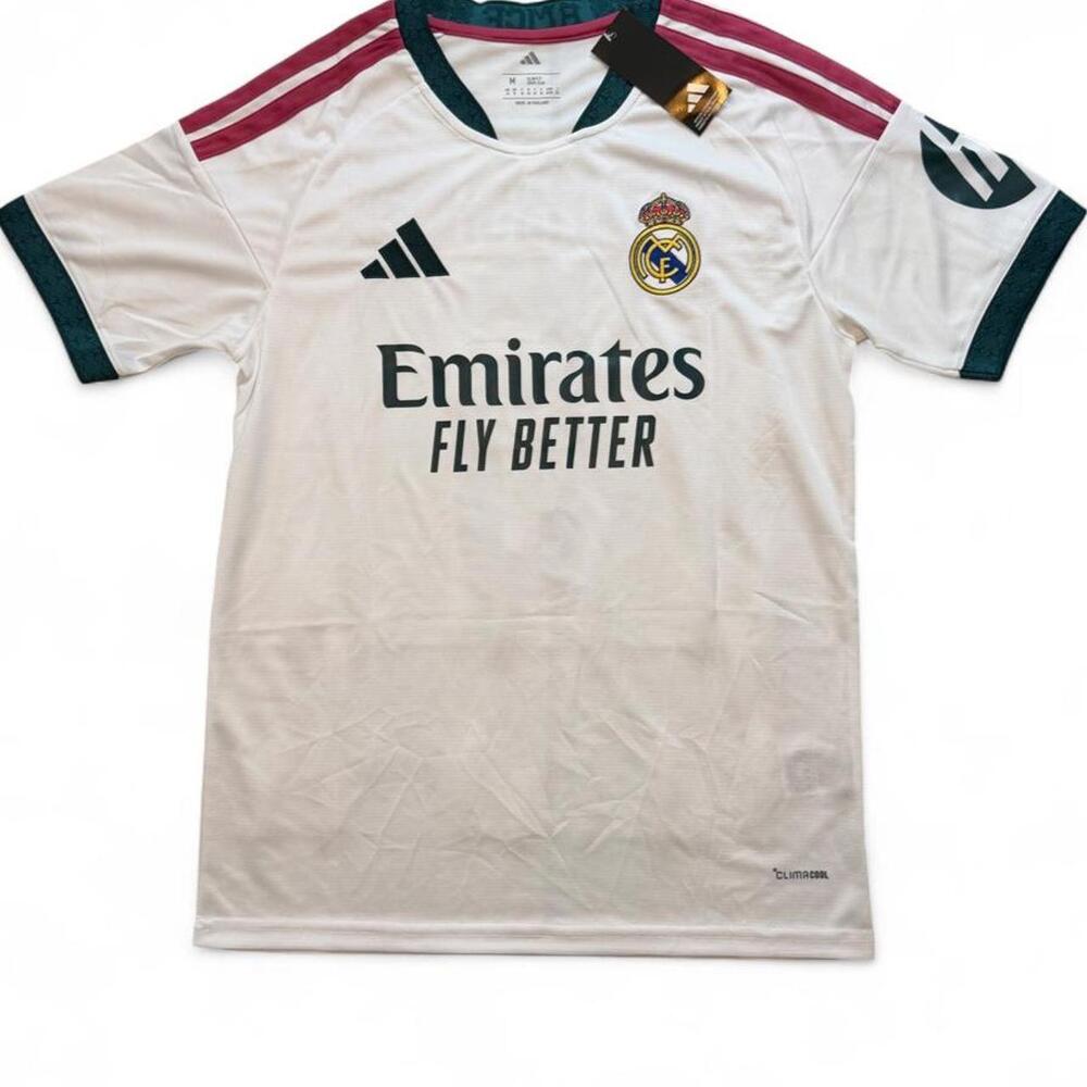 Adidas Real Madrid 2026/27 home shirt in white with maroon and dark green stripe